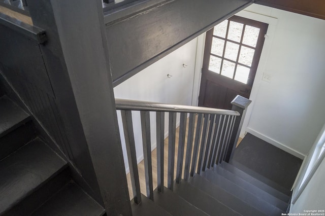 staircase featuring wood finished floors