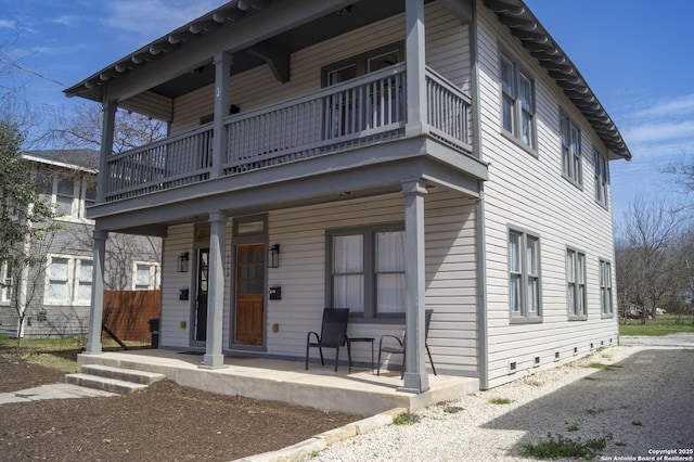 view of front facade with a balcony and a porch