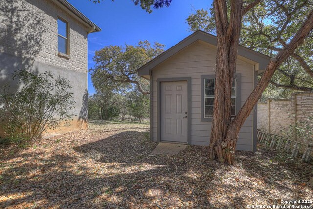 363 Buckhaven, Canyon Lake, TX 78133 - view of outbuilding with fence and an outdoor structure