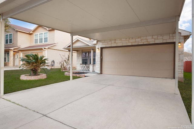 view of front of home featuring stone siding, driveway, and a front lawn