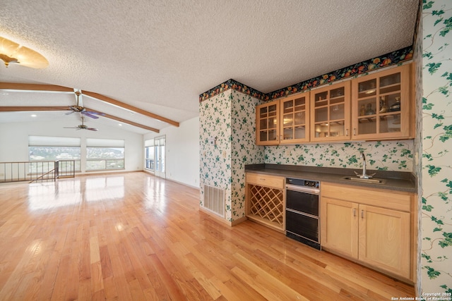 831 Hill Top, Canyon Lake, TX 78133 - bar with a sink, vaulted ceiling with beams, a textured ceiling, wallpapered walls, and ceiling fan