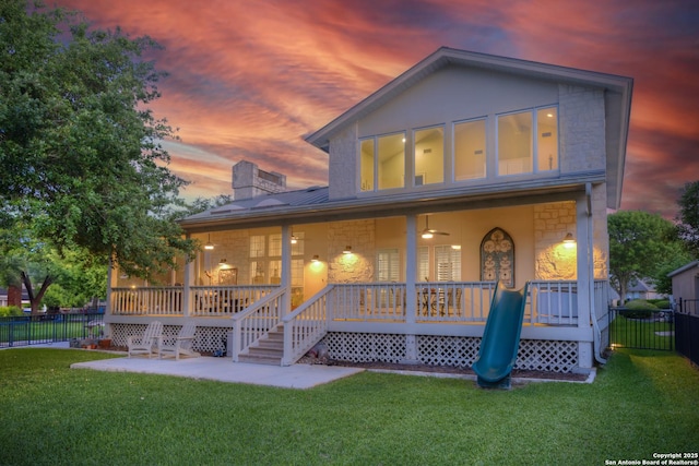 2408 Rock Crk, Kerrville, TX 78028 - rear view of property with stone siding, a chimney, a patio area, metal roof, and a standing seam roof