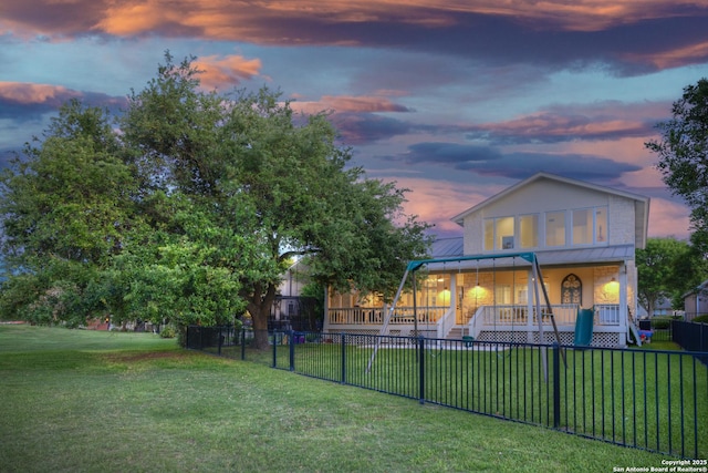 2408 Rock Crk, Kerrville, TX 78028 - back of house at dusk with a porch and metal roof
