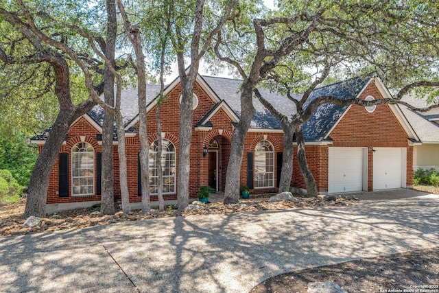 14834 Churchill Estates Blvd, San Antonio, TX 78248 - view of front of house featuring brick siding, roof with shingles, driveway, and a garage