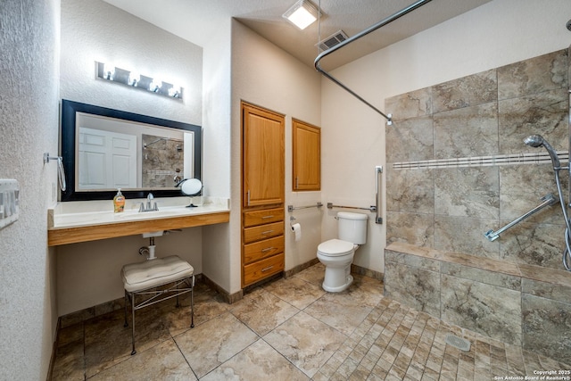 14834 Churchill Estates Blvd, San Antonio, TX 78248 - bathroom featuring tiled shower, toilet, a sink, and tile patterned floors