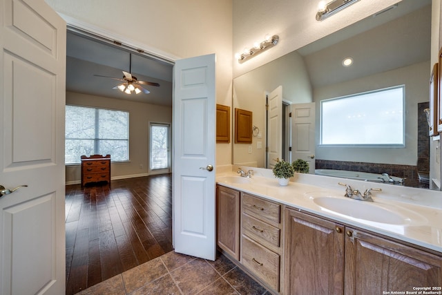 14834 Churchill Estates Blvd, San Antonio, TX 78248 - bathroom featuring healthy amount of natural light, ceiling fan, double vanity, a garden tub, and vaulted ceiling