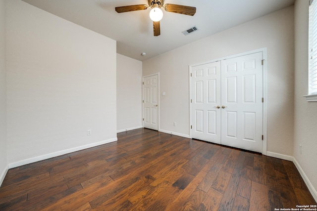 14834 Churchill Estates Blvd, San Antonio, TX 78248 - unfurnished bedroom featuring baseboards, dark wood finished floors, a ceiling fan, and a closet