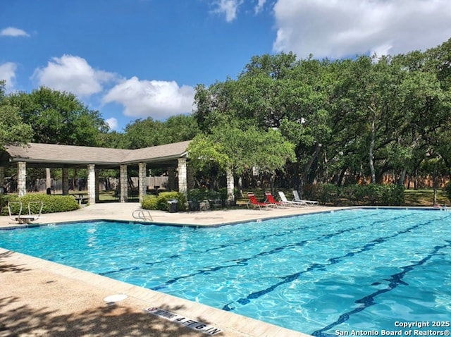 14834 Churchill Estates Blvd, San Antonio, TX 78248 - community pool with view of wooded area and a patio