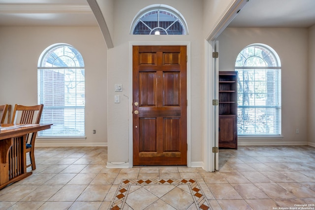 14834 Churchill Estates Blvd, San Antonio, TX 78248 - entrance foyer with light tile patterned flooring, arched walkways, and baseboards