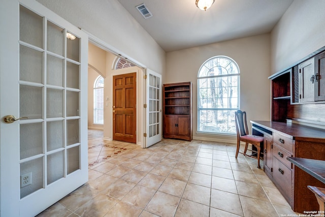 14834 Churchill Estates Blvd, San Antonio, TX 78248 - office with french doors, light tile patterned flooring, baseboards, and arched walkways