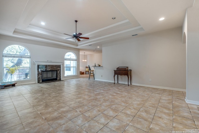 14834 Churchill Estates Blvd, San Antonio, TX 78248 - living room with a raised ceiling, a ceiling fan, a premium fireplace, baseboards, and recessed lighting