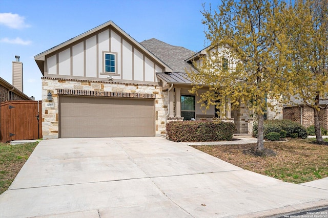 12007 White Riv, San Antonio, TX 78254 - english style home featuring concrete driveway, a standing seam roof, metal roof, stone siding, and a gate