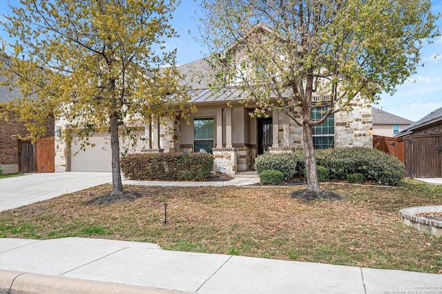 12007 White Riv, San Antonio, TX 78254 - view of front of property with driveway, a standing seam roof, stucco siding, an attached garage, and metal roof