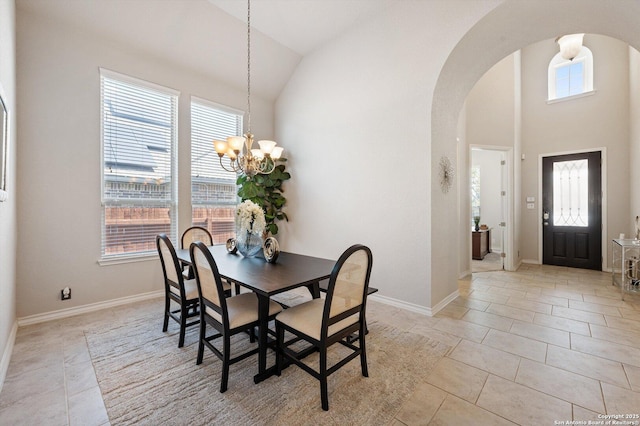 12007 White Riv, San Antonio, TX 78254 - dining area featuring arched walkways, baseboards, an inviting chandelier, and light tile patterned flooring