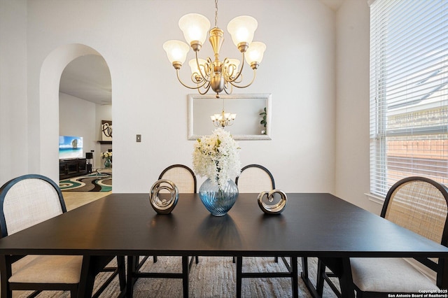 12007 White Riv, San Antonio, TX 78254 - dining space with arched walkways and a chandelier