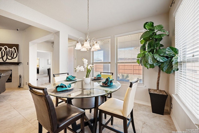 12007 White Riv, San Antonio, TX 78254 - dining space featuring baseboards, light tile patterned floors, and a notable chandelier