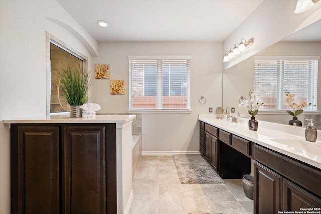 12007 White Riv, San Antonio, TX 78254 - full bath with double vanity, recessed lighting, baseboards, and a sink