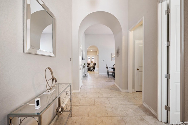12007 White Riv, San Antonio, TX 78254 - hallway with arched walkways and baseboards