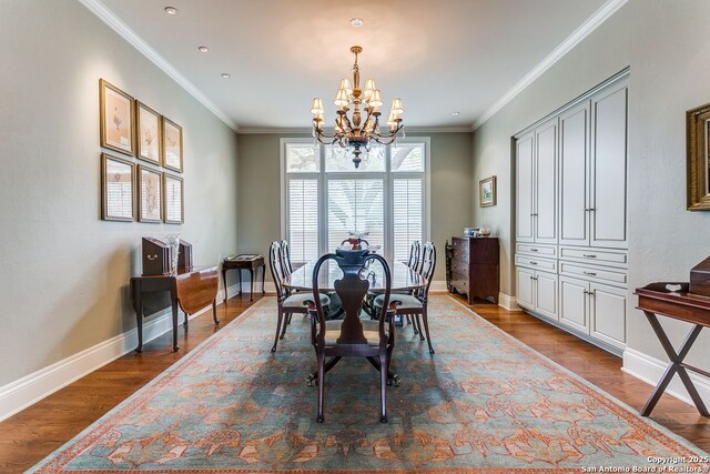 7 Oxford Hall, San Antonio, TX 78209 - dining space featuring a chandelier, wood finished floors, baseboards, and crown molding