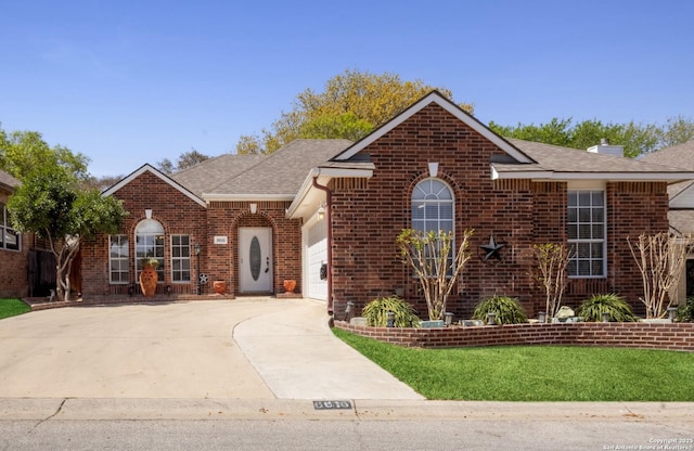 6615 Morning Shadow, San Antonio, TX 78256 - view of front of property featuring brick siding, concrete driveway, a shingled roof, and an attached garage