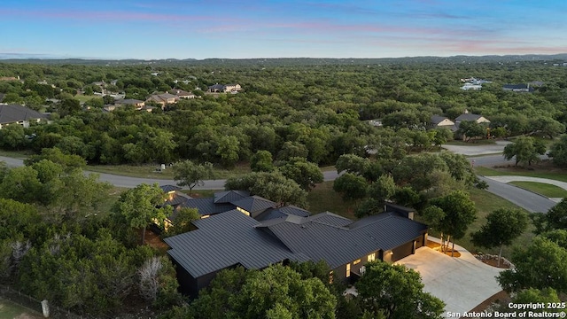 aerial view with a wooded view