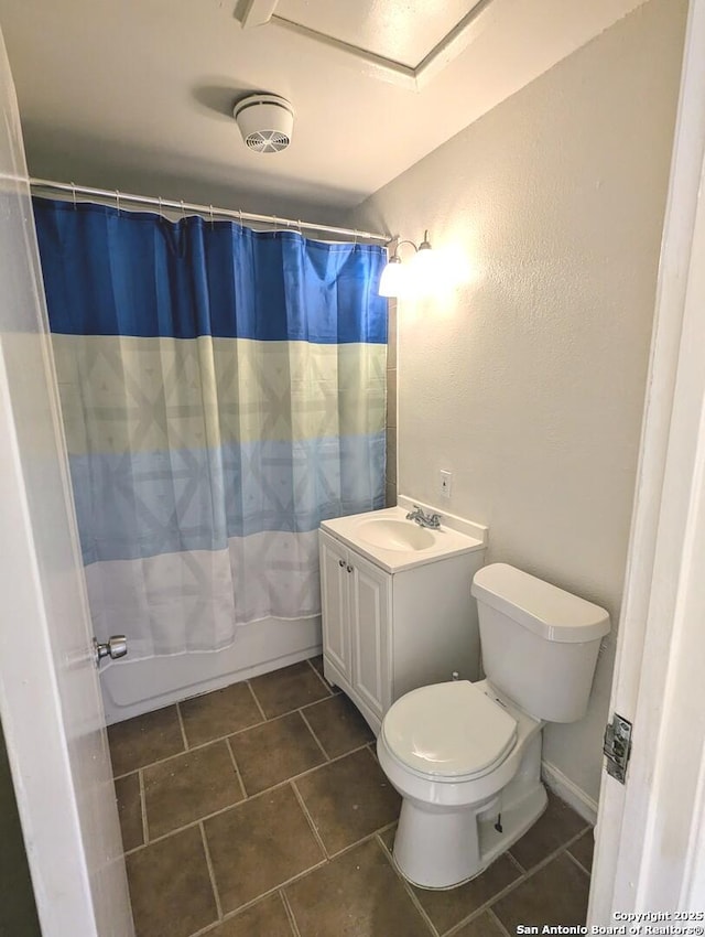 full bathroom featuring tile patterned floors, toilet, shower / tub combo with curtain, and vanity