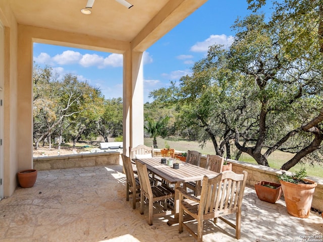 view of patio featuring a ceiling fan and outdoor dining area