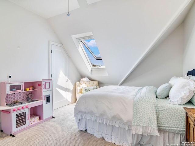 bedroom featuring light carpet and lofted ceiling with skylight