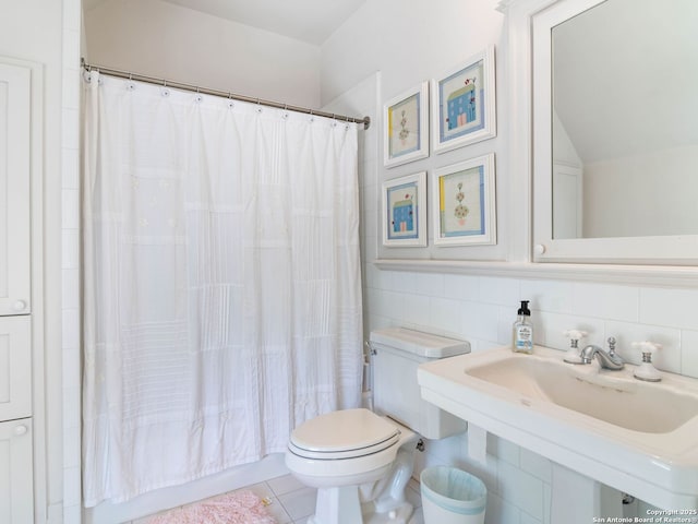 full bath with a sink, shower / tub combo with curtain, toilet, tile walls, and decorative backsplash