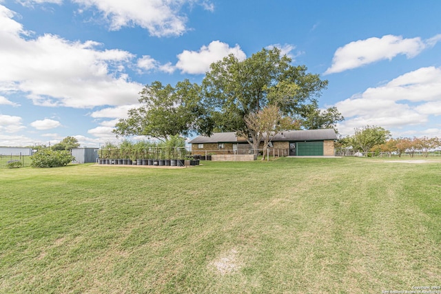 view of yard with a garage