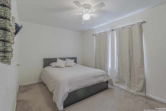 4907 Heather Pass, San Antonio, TX 78218 - carpeted bedroom featuring a ceiling fan and a textured ceiling