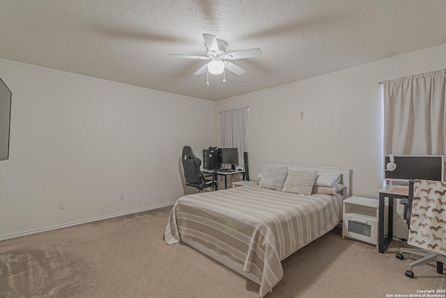 4907 Heather Pass, San Antonio, TX 78218 - bedroom with carpet flooring, baseboards, ceiling fan, and a textured ceiling