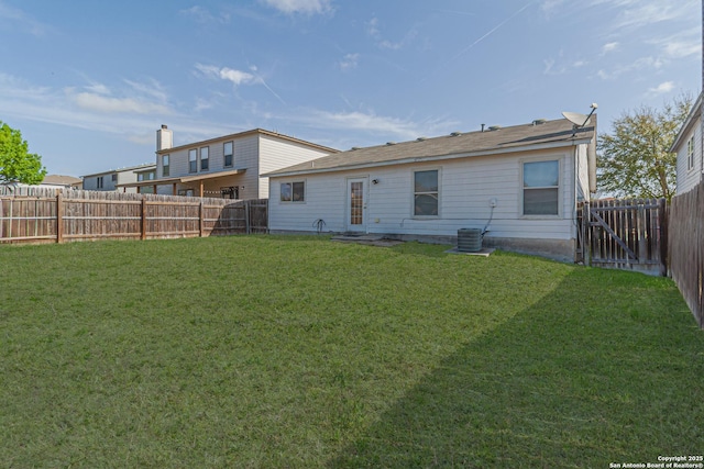 4907 Heather Pass, San Antonio, TX 78218 - rear view of house featuring a fenced backyard and a lawn