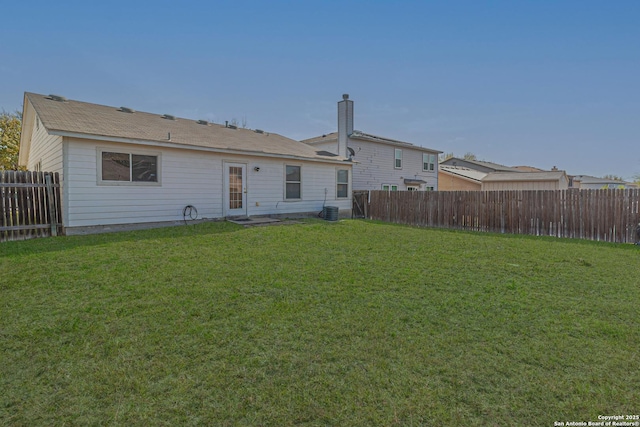 4907 Heather Pass, San Antonio, TX 78218 - back of property featuring a fenced backyard, central AC unit, and a yard