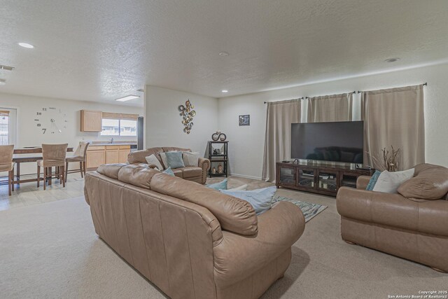 4907 Heather Pass, San Antonio, TX 78218 - living room with recessed lighting, visible vents, and a textured ceiling