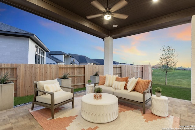 305 Barton, Boerne, TX 78006 - patio terrace at dusk with ceiling fan, a patio area, a fenced backyard, and outdoor lounge area