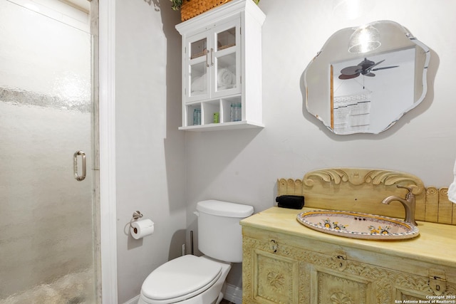 608 W Morse St, Fredericksburg, TX 78624 - bathroom featuring a stall shower, toilet, vanity, and baseboards