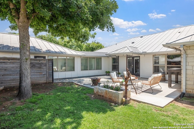 608 W Morse St, Fredericksburg, TX 78624 - rear view of property featuring a standing seam roof, metal roof, a patio, and board and batten siding