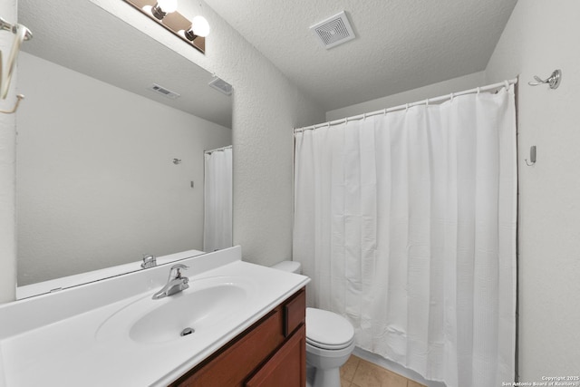 12266 Stratsburg, San Antonio, TX 78252 - full bath featuring visible vents, toilet, tile patterned flooring, and a textured ceiling