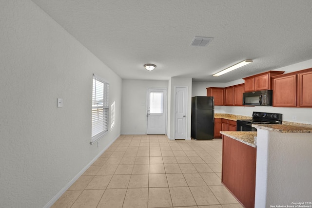 12266 Stratsburg, San Antonio, TX 78252 - kitchen with a textured ceiling, light tile patterned flooring, visible vents, light stone countertops, and black appliances