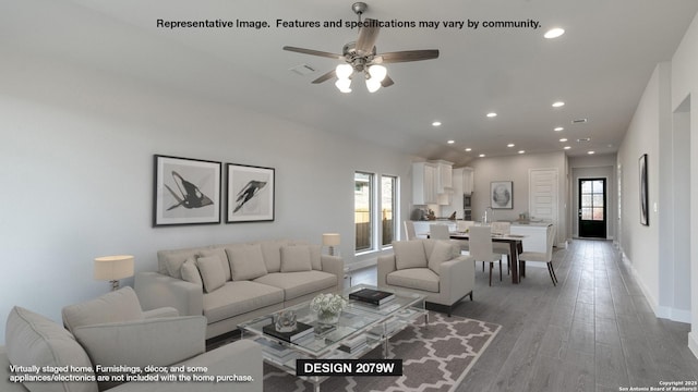 12937 Gilmore Bnd, San Antonio, TX 78245 - living room with light wood-style flooring, plenty of natural light, recessed lighting, and visible vents