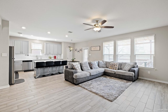 1623 Iron Crk, San Antonio, TX 78245 - living room featuring a ceiling fan, baseboards, light wood-style flooring, and recessed lighting