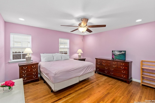 bedroom with baseboards, wood finished floors, recessed lighting, and a ceiling fan