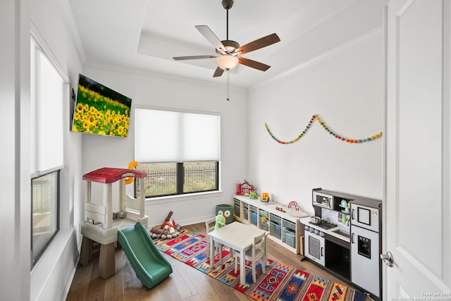 23427 Grande Vis, San Antonio, TX 78261 - rec room with a ceiling fan, ornamental molding, baseboards, and wood finished floors