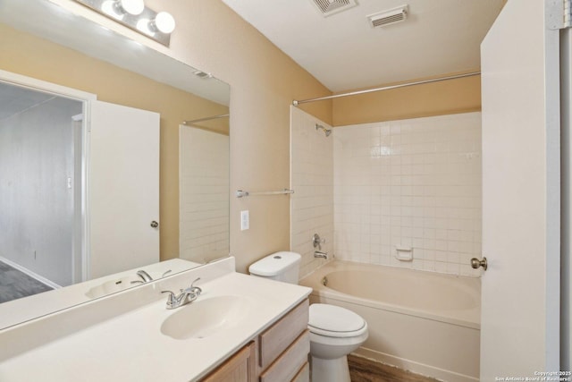 full bathroom featuring shower / bathing tub combination, vanity, toilet, visible vents, and wood finished floors