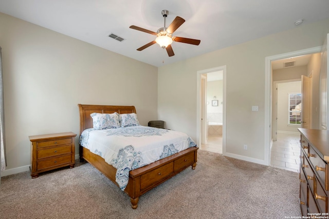 146 Sunrise Hl, Castroville, TX 78009 - bedroom featuring baseboards, connected bathroom, visible vents, and light colored carpet