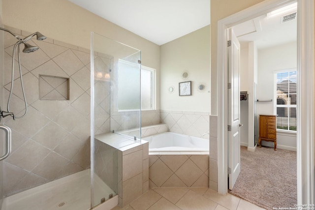146 Sunrise Hl, Castroville, TX 78009 - full bathroom with a stall shower, tile patterned flooring, a garden tub, and visible vents