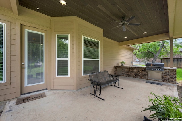 146 Sunrise Hl, Castroville, TX 78009 - view of patio featuring exterior kitchen, ceiling fan, grilling area, and fence