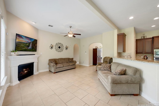 146 Sunrise Hl, Castroville, TX 78009 - living area featuring light tile patterned floors, ceiling fan, recessed lighting, and visible vents