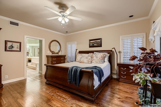 409 Sandy Oaks, Boerne, TX 78015 - bedroom with wood finished floors, ornamental molding, multiple windows, and visible vents